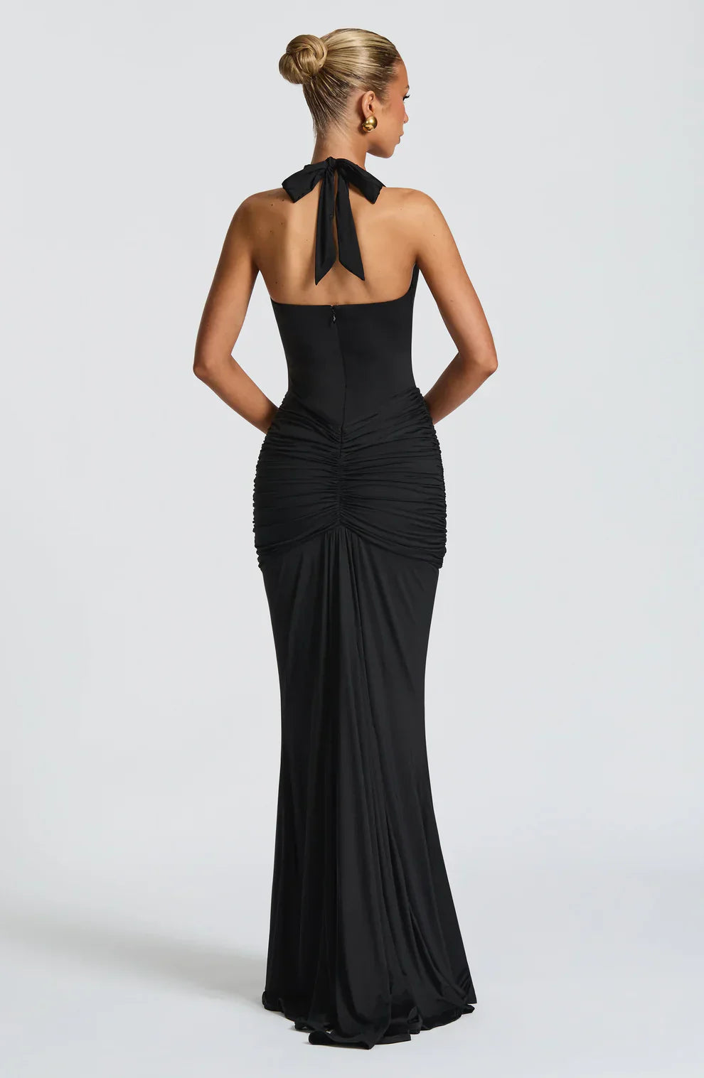Back view of black halter maxi dress with tied neck detail