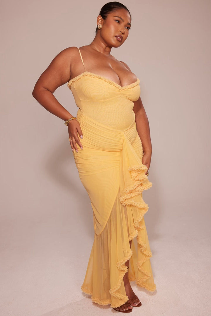 Yellow spaghetti strap maxi dress with ruched waist and ruffled asymmetrical skirt
