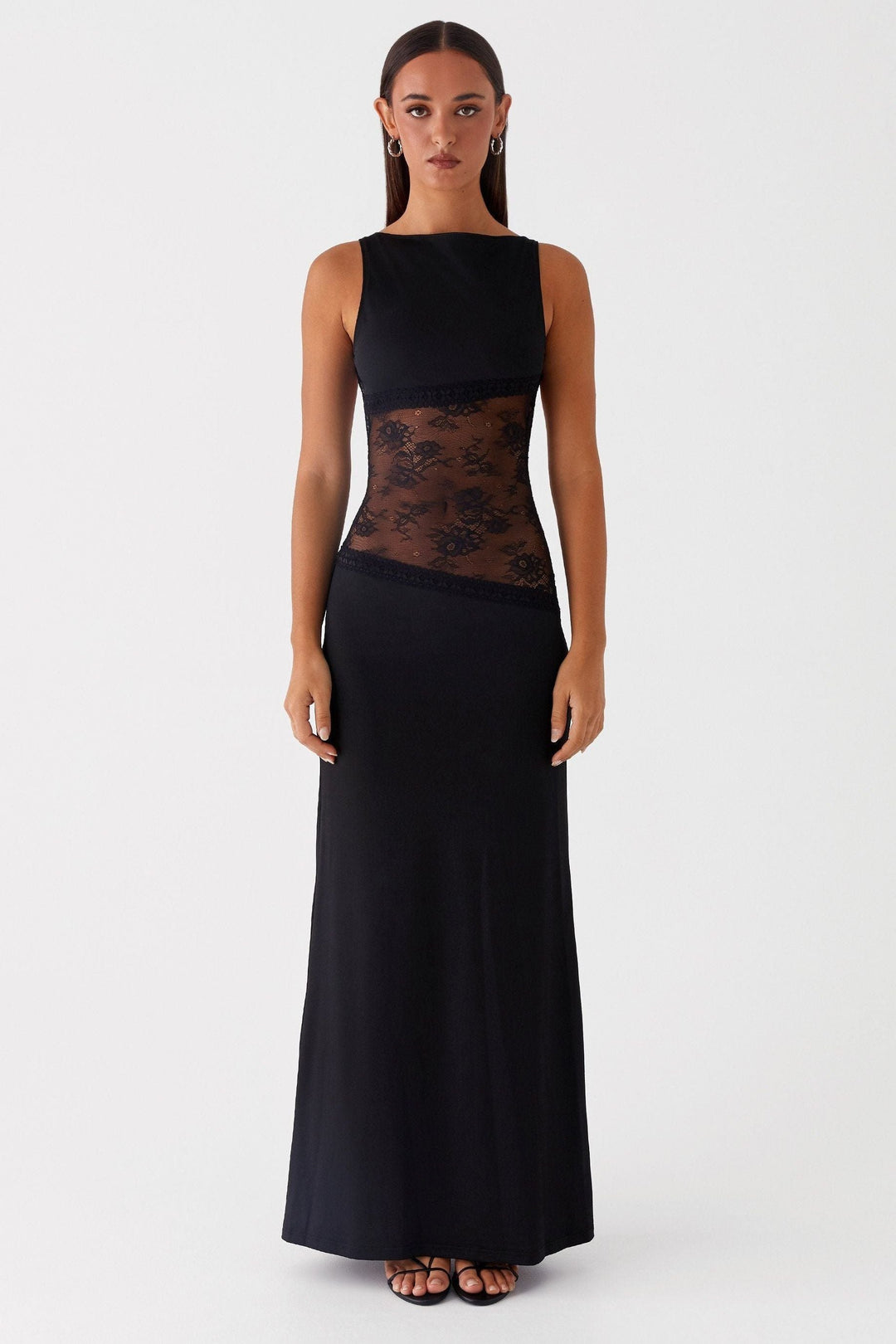 Front view of black sleeveless maxi dress with floral lace waist band