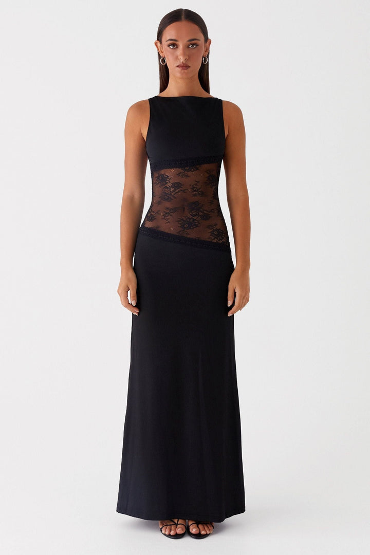 Front view of black sleeveless maxi dress with floral lace waist band