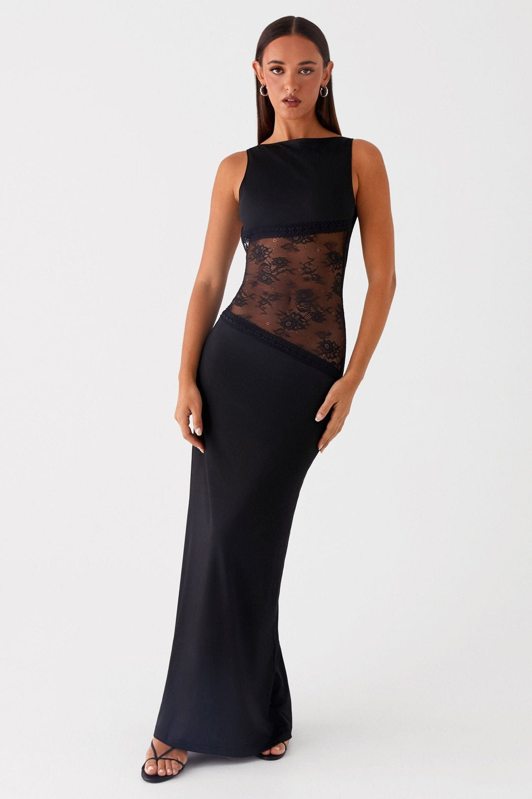 Black sleeveless maxi dress with sheer lace waist, front facing pose