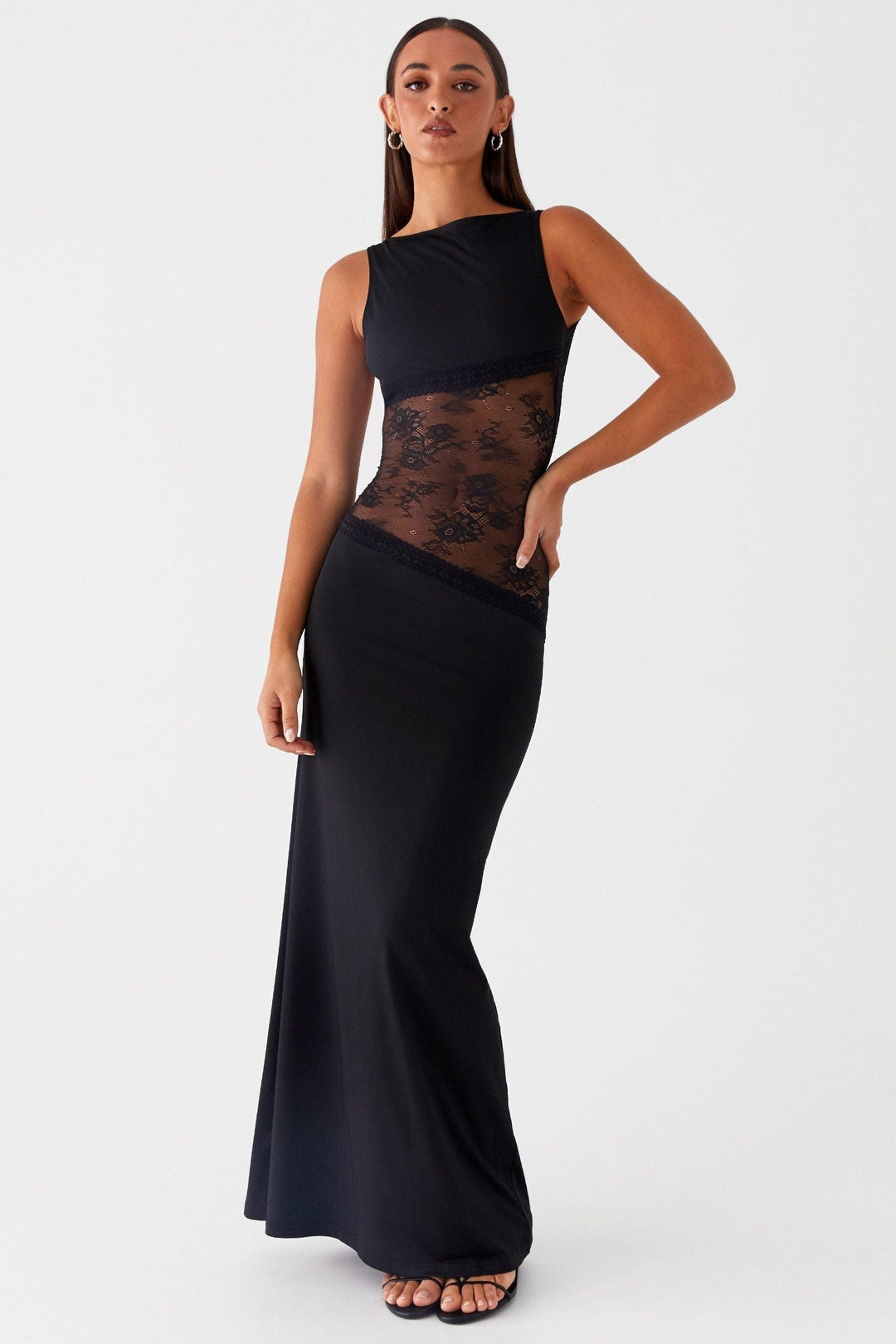 Black sleeveless maxi dress with lace waist detail, three-quarter view