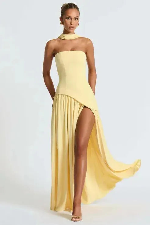 Yellow strapless maxi dress with high slit and flowing skirt detail