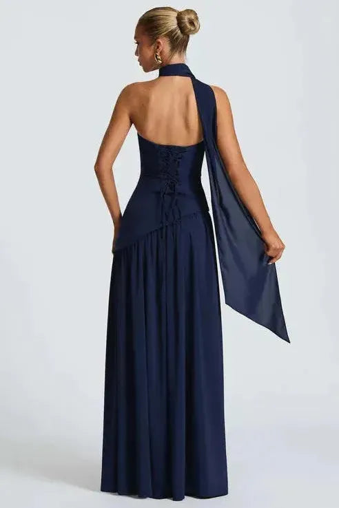 Navy blue strapless maxi dress with halter choker and flowing high slit back view