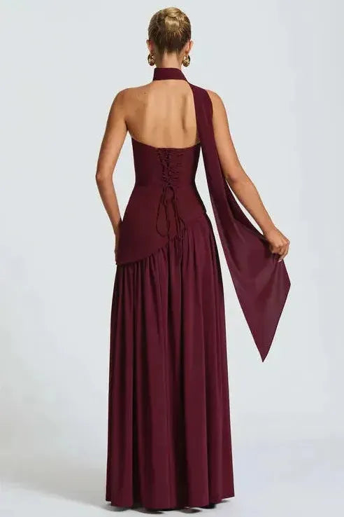 Back view of burgundy maxi dress showing lace-up corset back and high leg slit