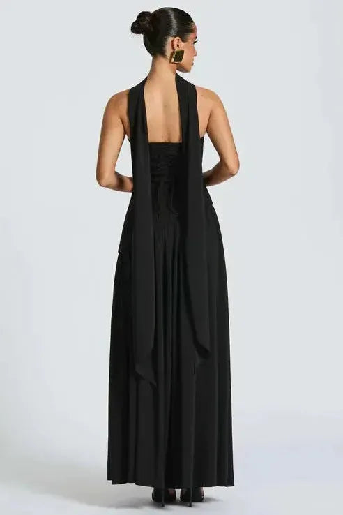 Back view of black strapless maxi dress with open back and high slit leg opening