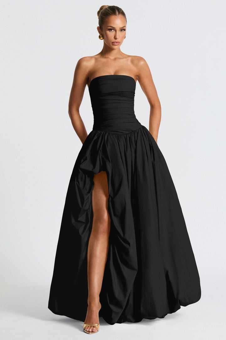 Black strapless ruched maxi dress with high-low hemline and full skirt