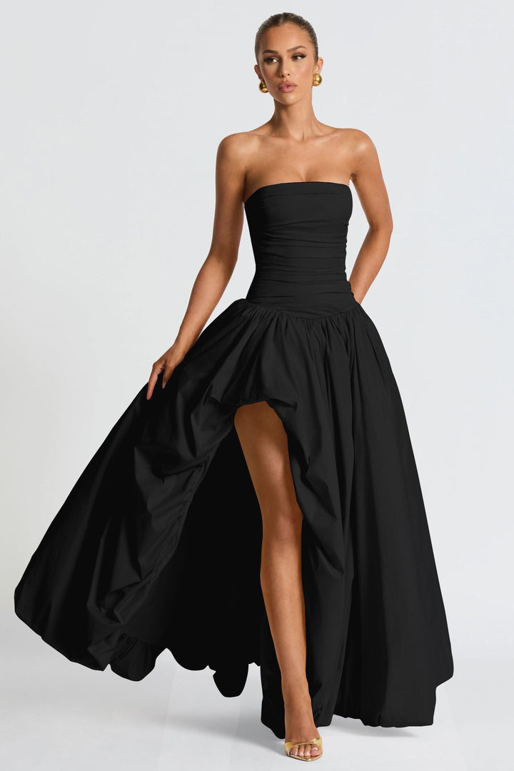 Black ruched strapless maxi dress with asymmetrical high-low hem detail