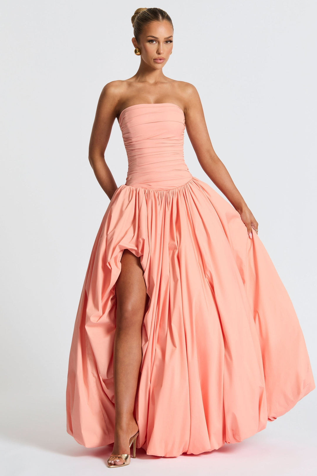 Coral pink strapless ruched maxi dress with high-low asymmetrical hemline