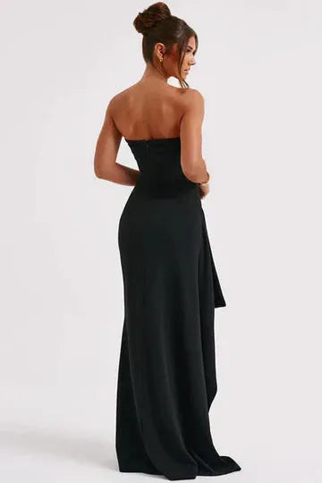 Back view black strapless maxi dress showing draped split train
