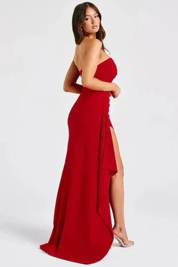 Side view red strapless maxi dress with flowing split skirt detail