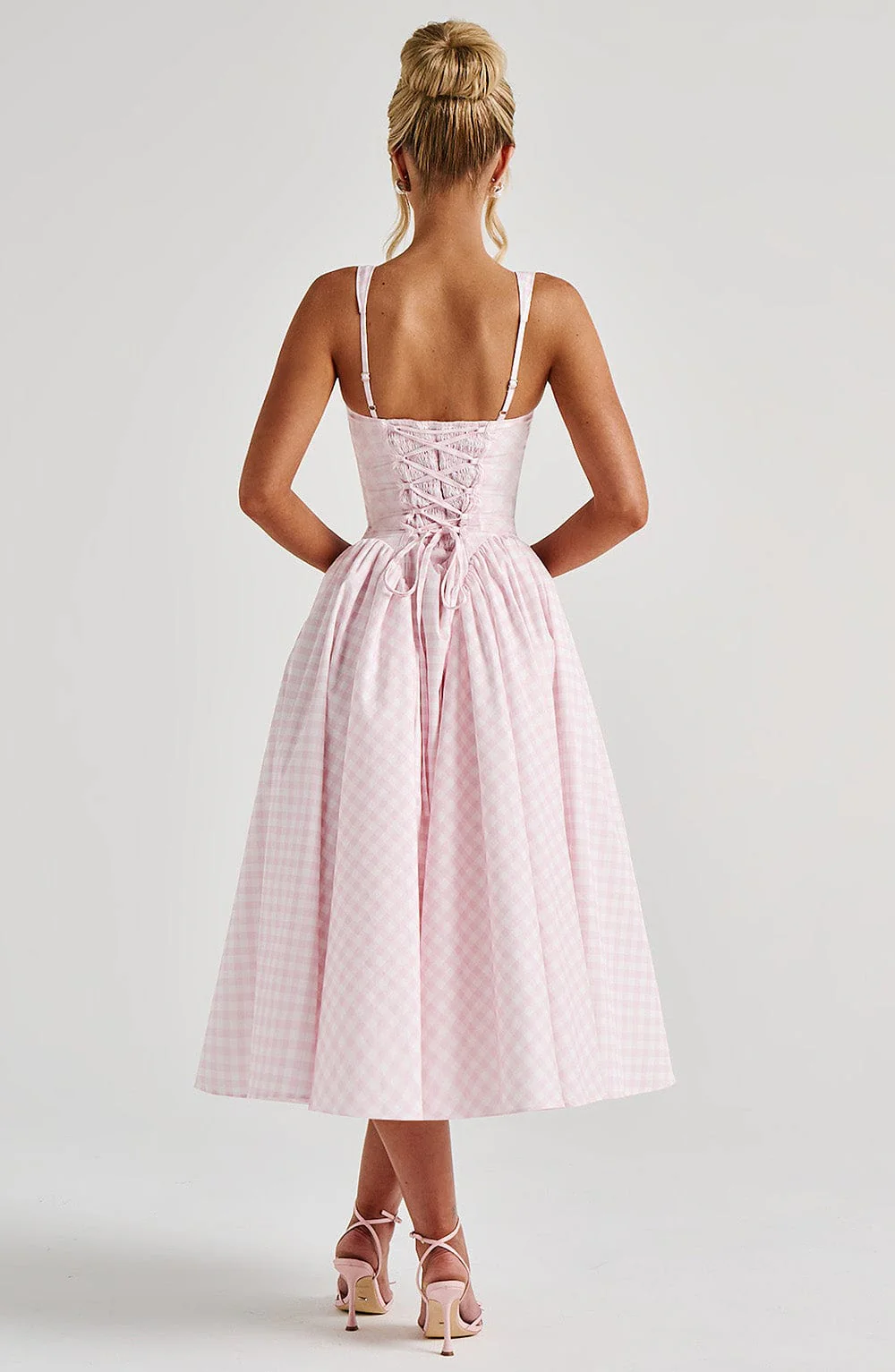 Pink gingham midi dress with functional lace-up back detail and flared hem back view