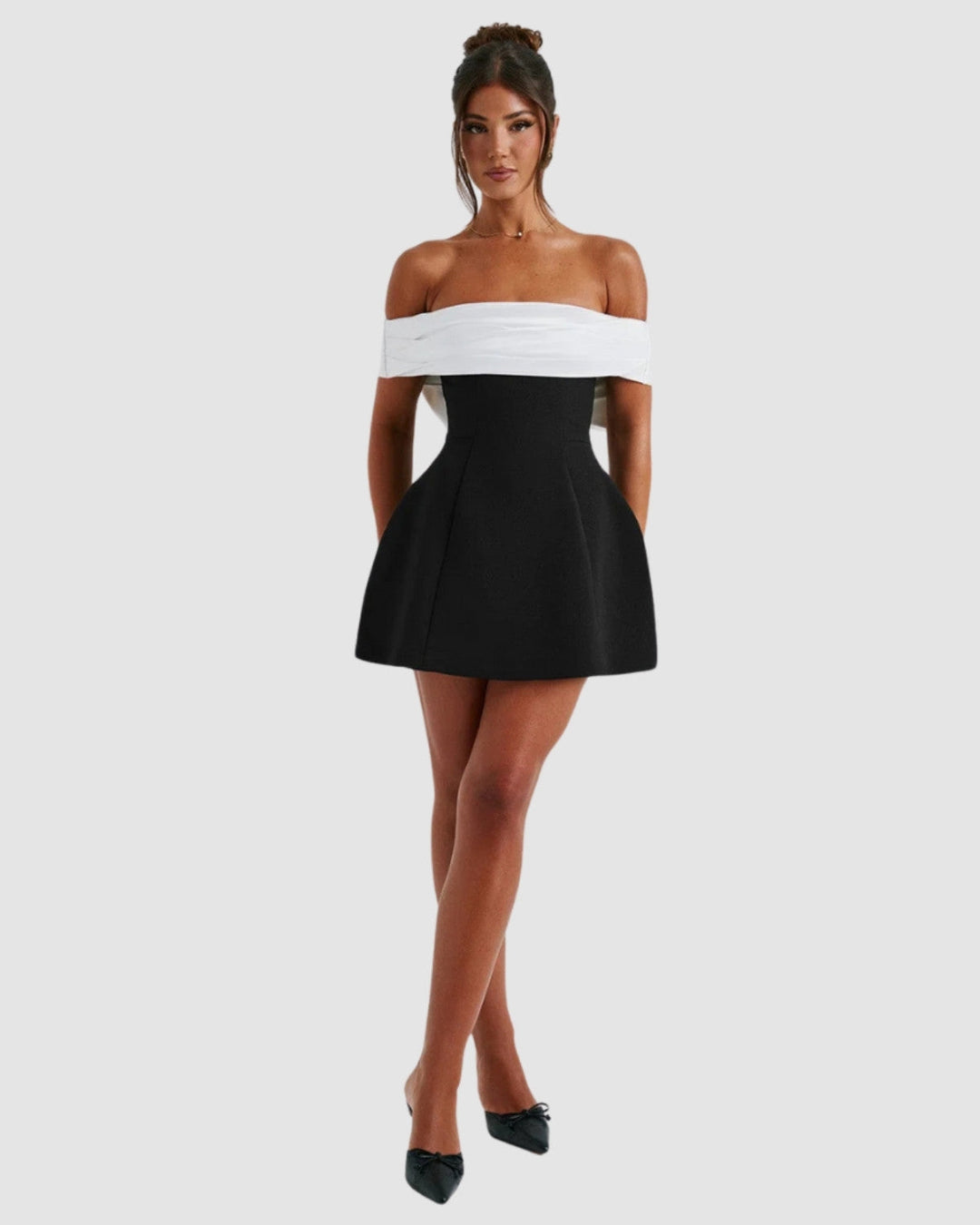 Full-length front view of women's black and white color-block party mini dress