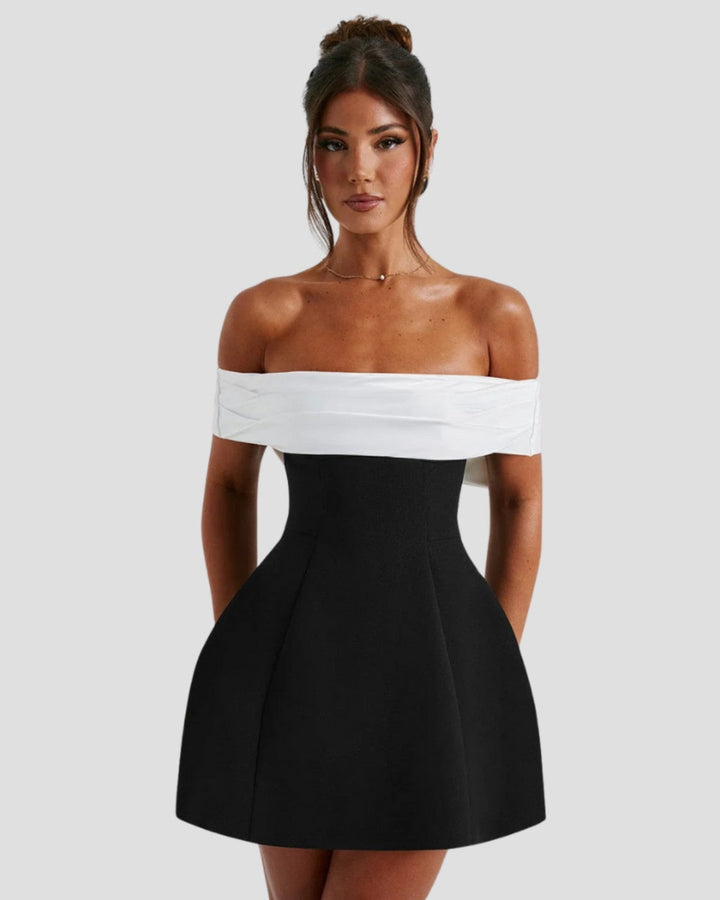 Women's off-shoulder black and white mini dress with wrapped neckline, front view