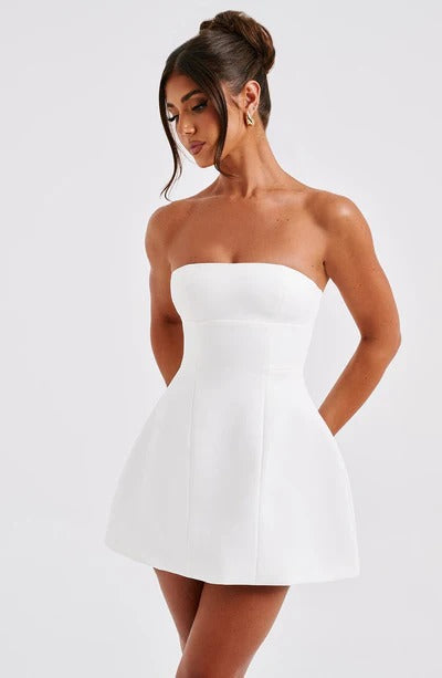 White strapless bubble mini dress with seamed bodice, side angle view