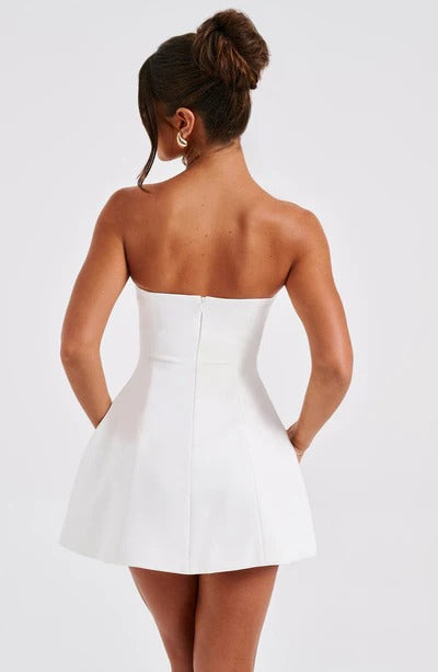 White strapless bubble mini dress with seamed bodice, back view showing center seam