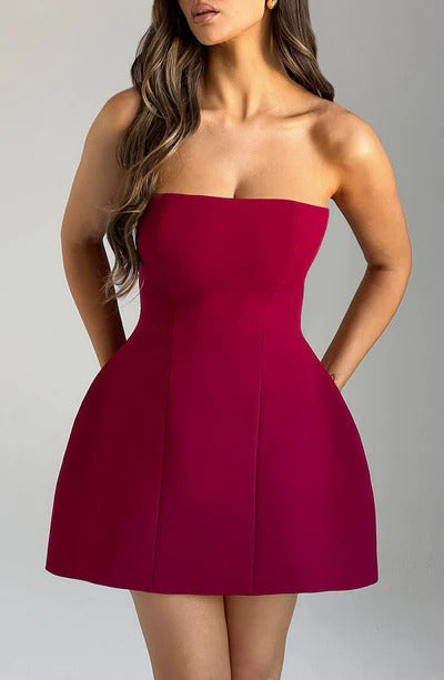 Burgundy strapless bubble mini dress with seamed bodice, side angle view