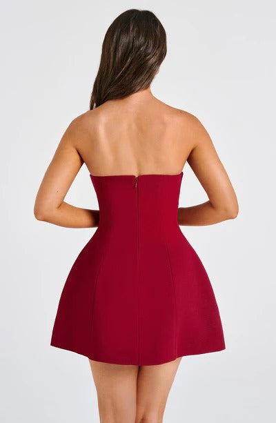 Burgundy strapless bubble mini dress with seamed bodice, back view with center seam