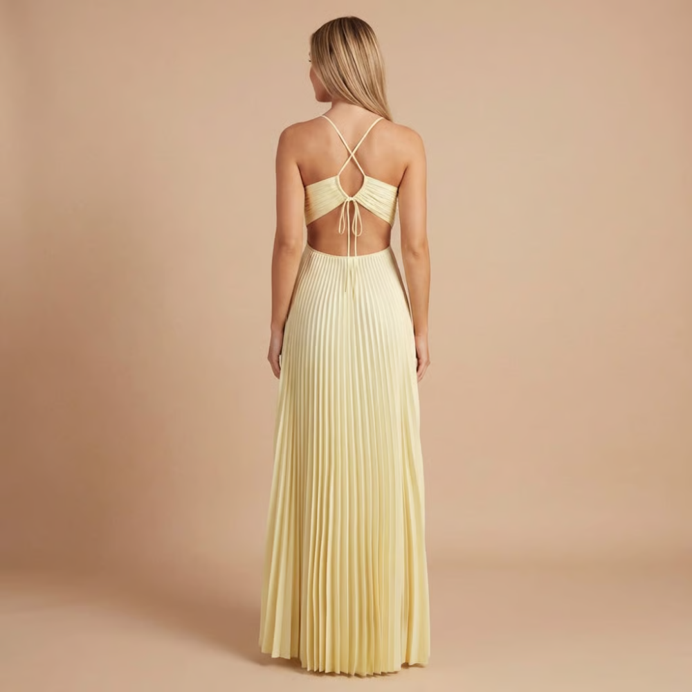 Back view of cream halter maxi dress showing tied cutout waist detail
