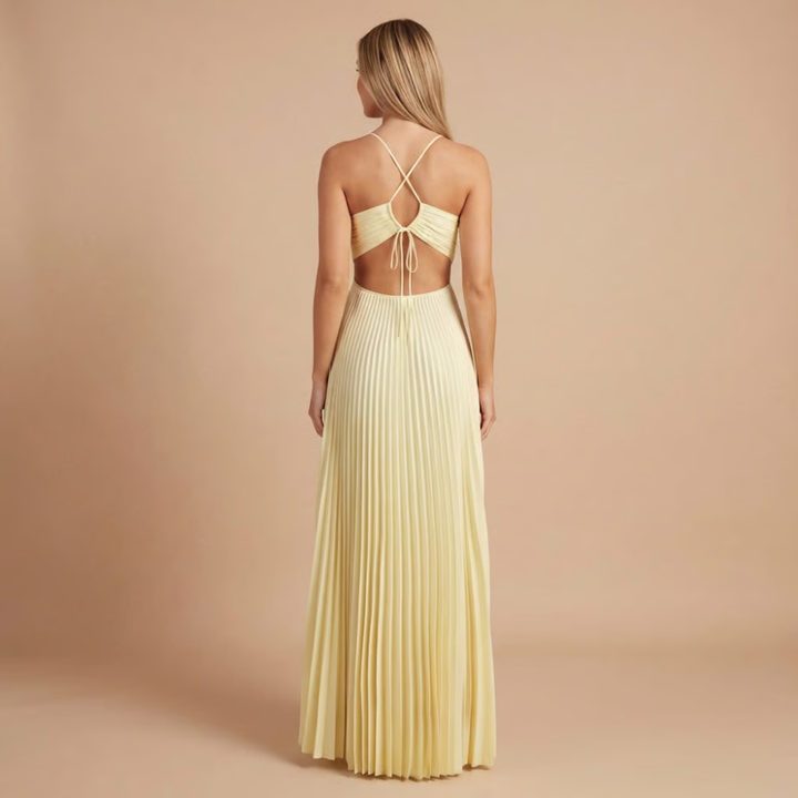 Back view of cream halter maxi dress showing tied cutout waist detail