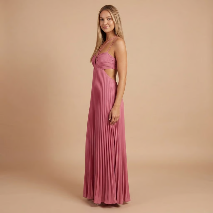 Side view of mauve pink halter maxi dress showing cutout waist