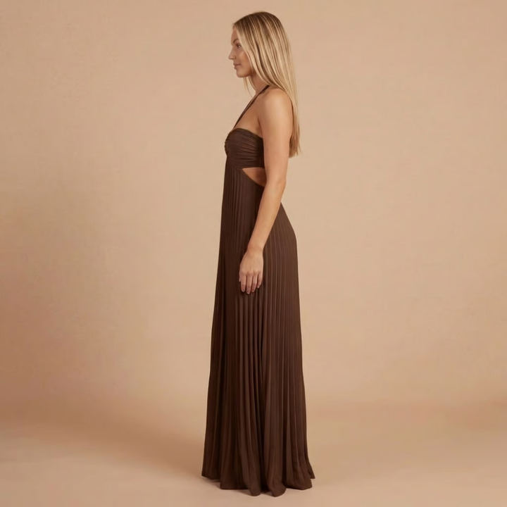 Side profile of brown halter maxi dress with pleated skirt and cutout