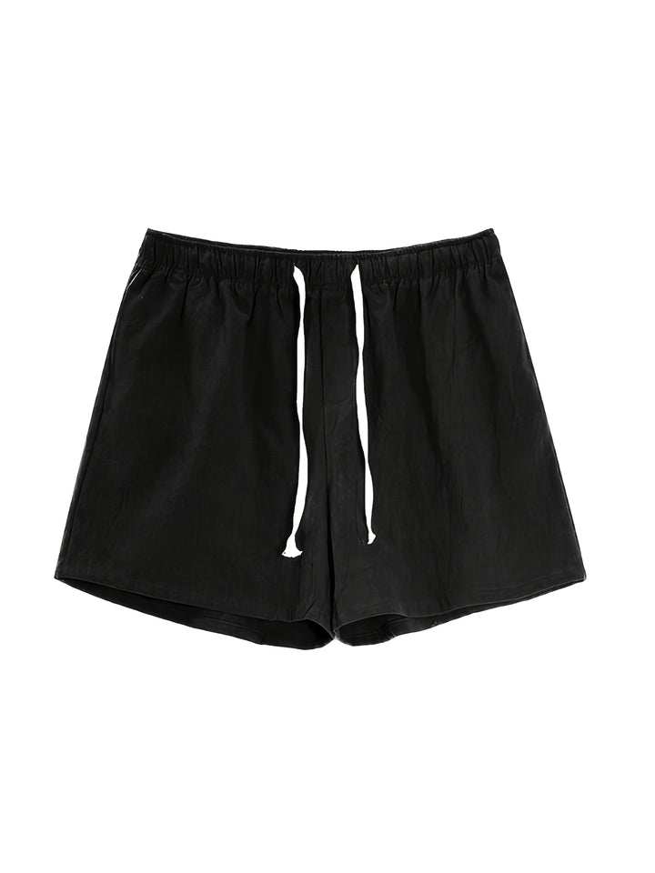 Black men swim shorts shown front view with loose fit and white drawstring bathing suit