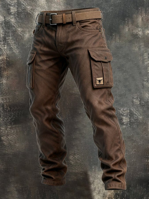 Men brown cargo pants with belt, rugged cotton texture and utility pockets on dark backdrop
