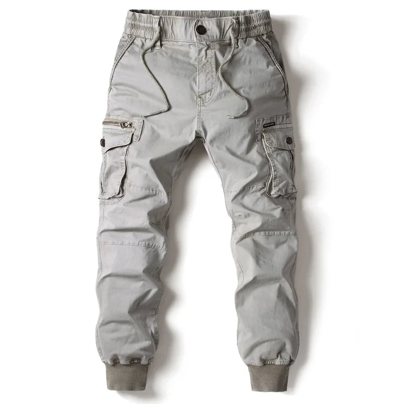 Light gray men cargo jogger pants with side flap pockets, drawstring waist, and cuffs