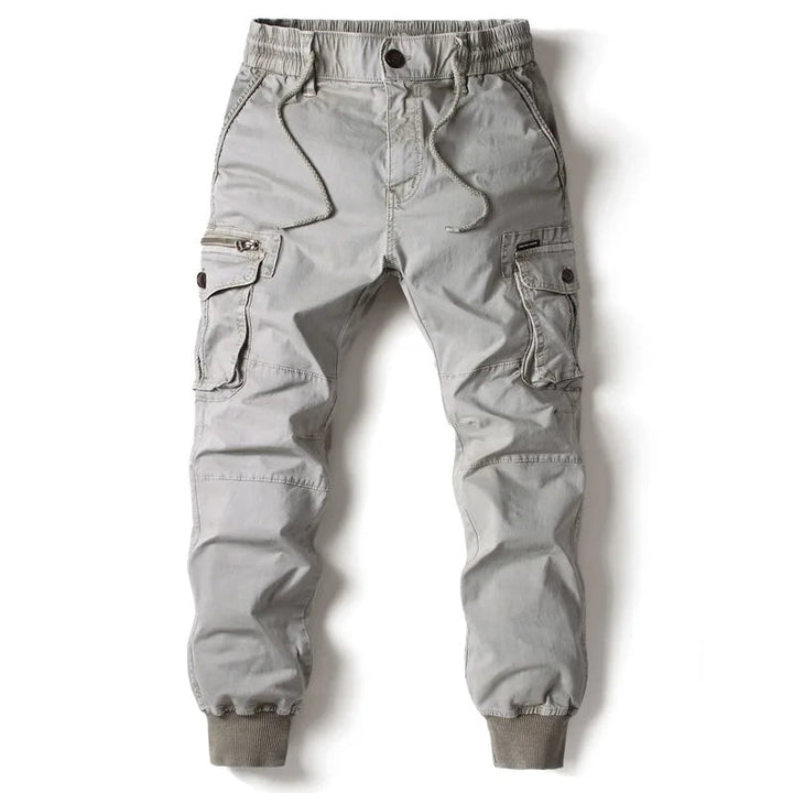 Light gray men cargo jogger pants with side flap pockets, drawstring waist, and cuffs