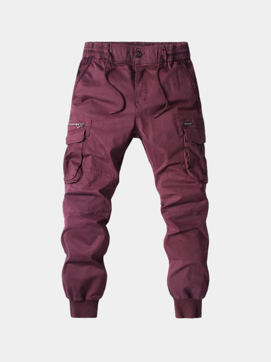 Maroon men cargo jogger pants with elastic waist, drawstring, and side flap pockets