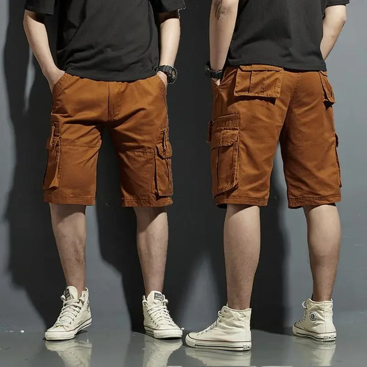 Brown cargo knee length shorts with large flap pockets, front and back view on model