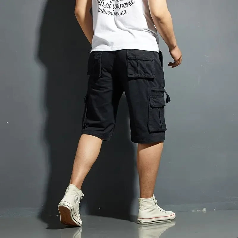 Black cargo shorts for men shown from the back with flap pockets and knee length fit