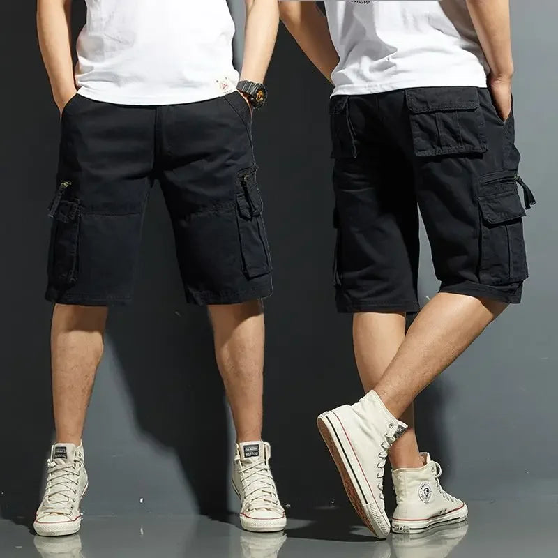 Black cargo knee length shorts with side flap pockets, shown front and back on model