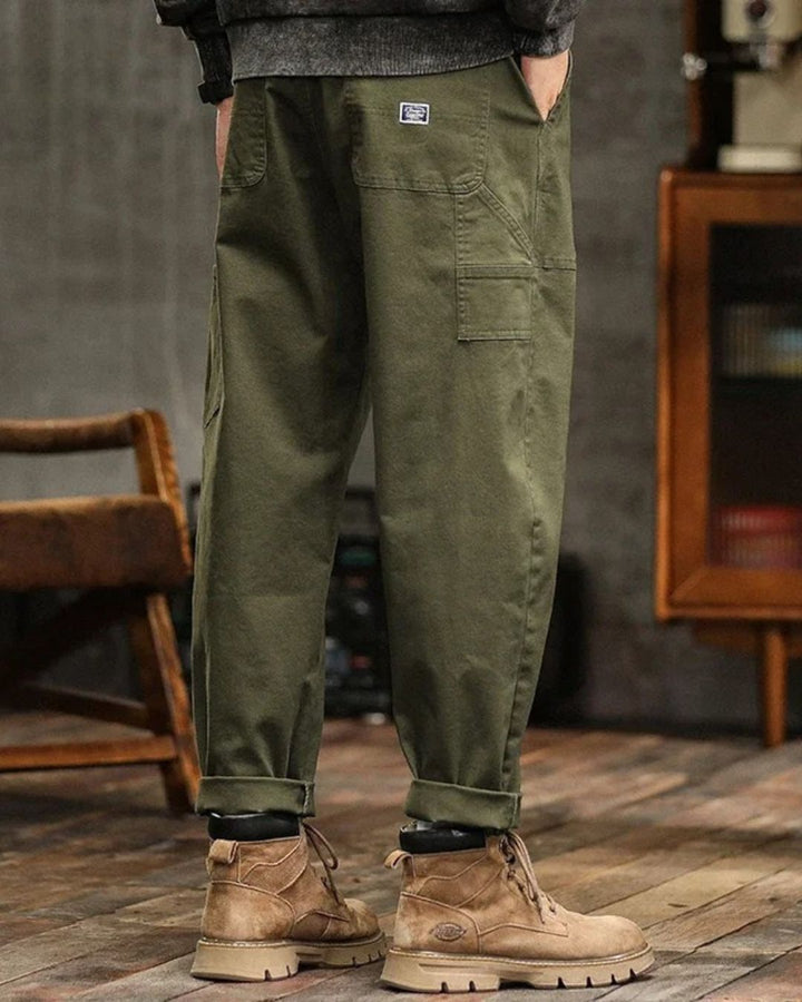 Back view of olive green workwear cargo pants with straight leg and utility pockets