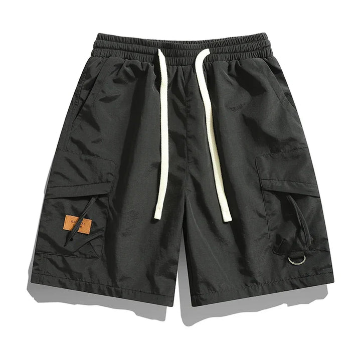 Black men's cargo shorts with elastic waistband, drawstring, and utility pockets
