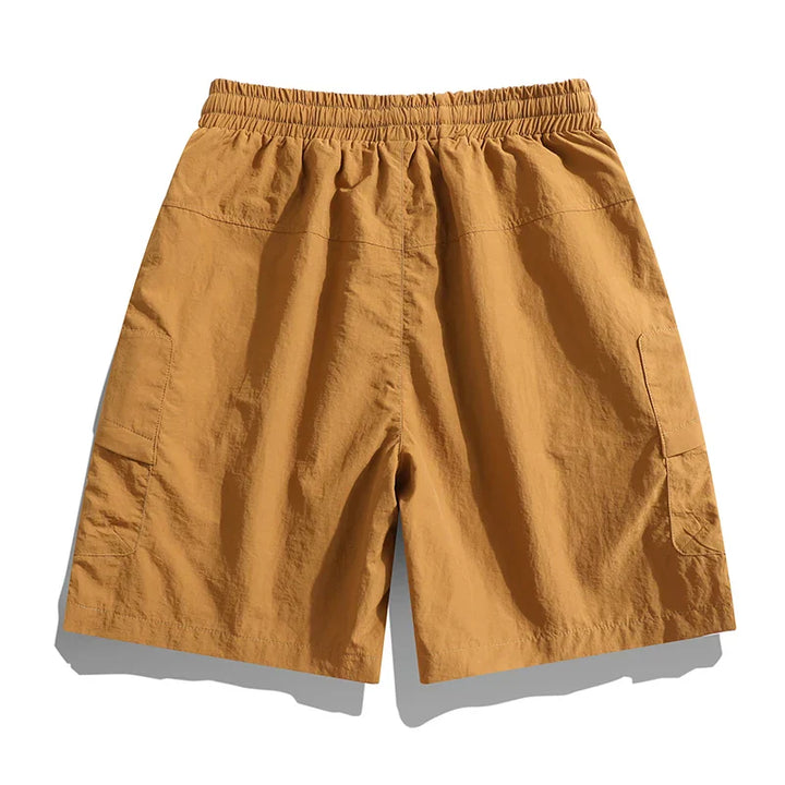 Tan men's cargo shorts back view with elastic waist and roomy summer fit