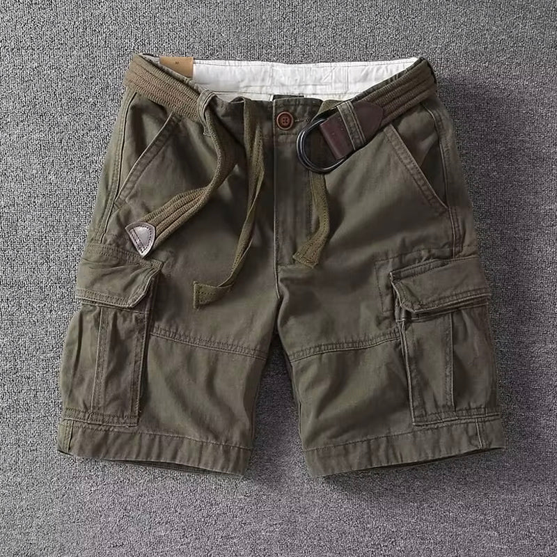 Olive green men cargo shorts with belt, multi pocket casual fit, front view flat lay on gray