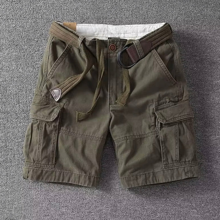 Olive green men cargo shorts with belt, multi pocket casual fit, front view flat lay on gray
