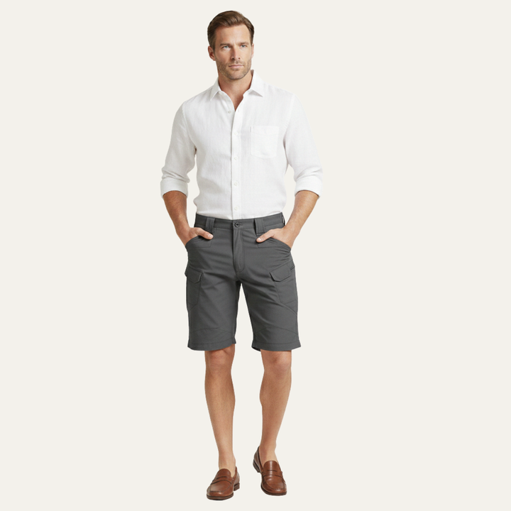 Charcoal gray cargo shorts for men worn with a white shirt, full-length model shot