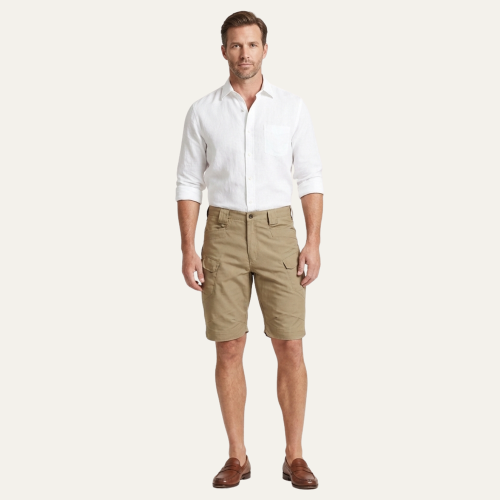 Men cargo shorts in khaki styled with a white shirt, full-length model view