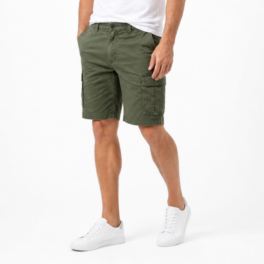 Olive green men cargo shorts with side flap pockets, casual summer shorts on model