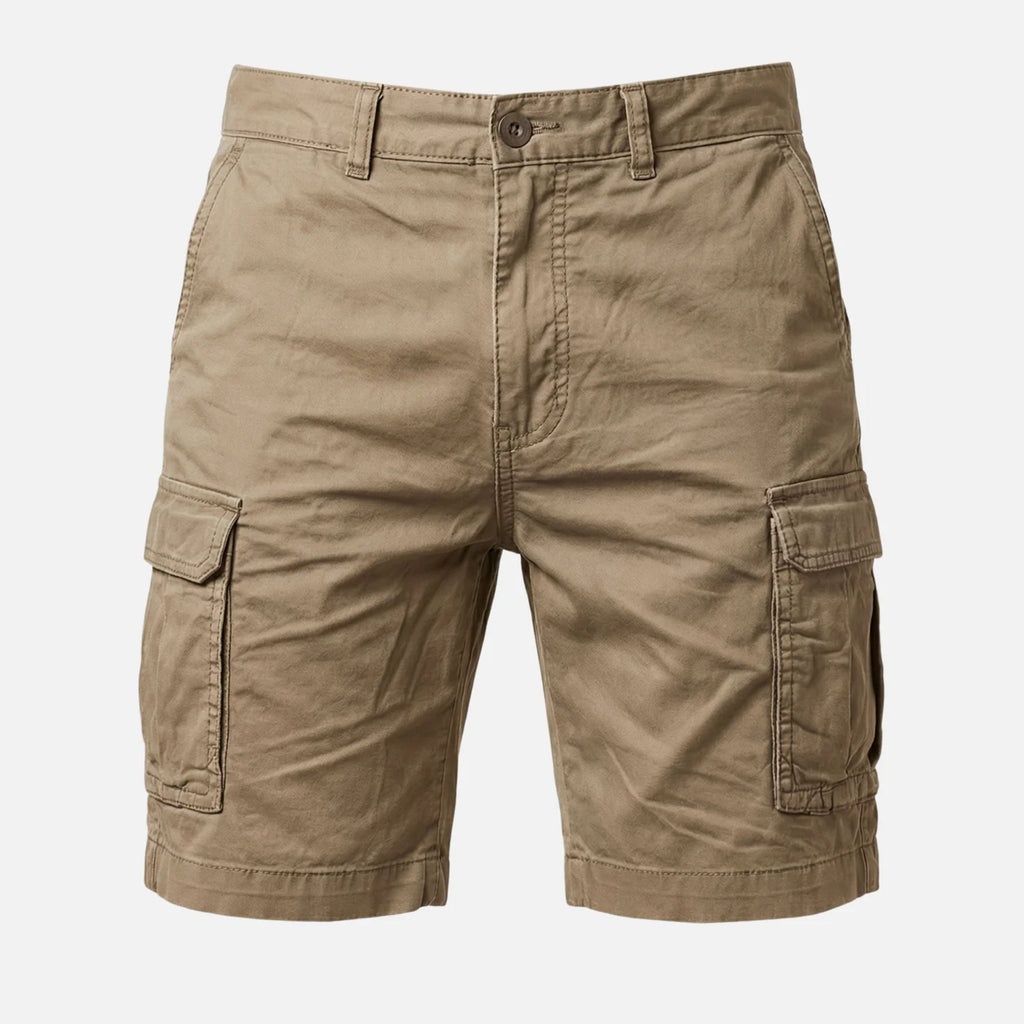 Front close-up of tan cargo shorts showing pocket flap and stitched hem detail