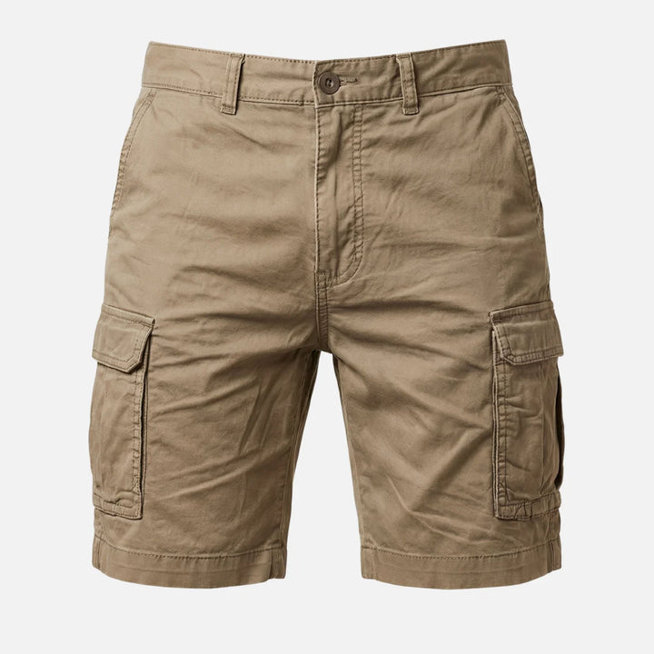 Front close-up of tan cargo shorts showing pocket flap and stitched hem detail