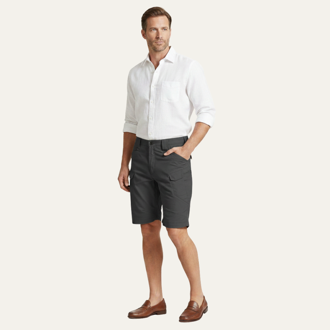Dark gray cargo shorts for men worn with a white shirt, full-length model view