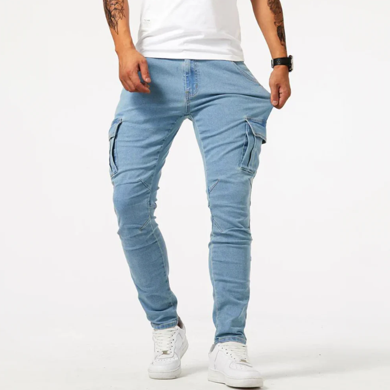 Light blue cargo skinny jeans with side pockets, front view on male model in white sneakers