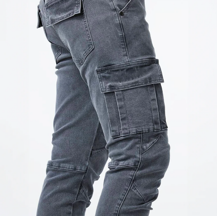 Close-up side view of gray cargo skinny jeans showing flap side pockets and stitched seams