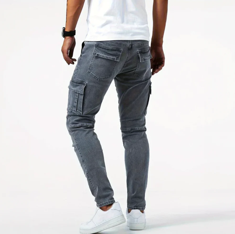 Back view of gray cargo skinny jeans with rear pockets, side cargo pocket, and tapered fit