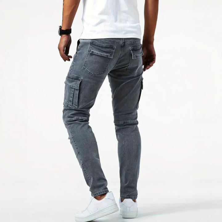Back view of gray cargo skinny jeans with rear pockets, side cargo pocket, and tapered fit