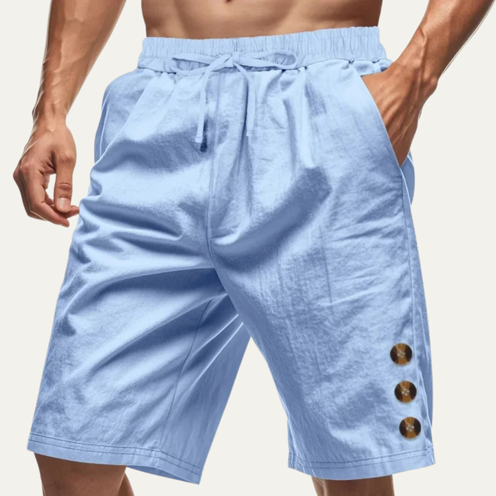 Light blue casual shorts with drawstring waist and three button detail on model